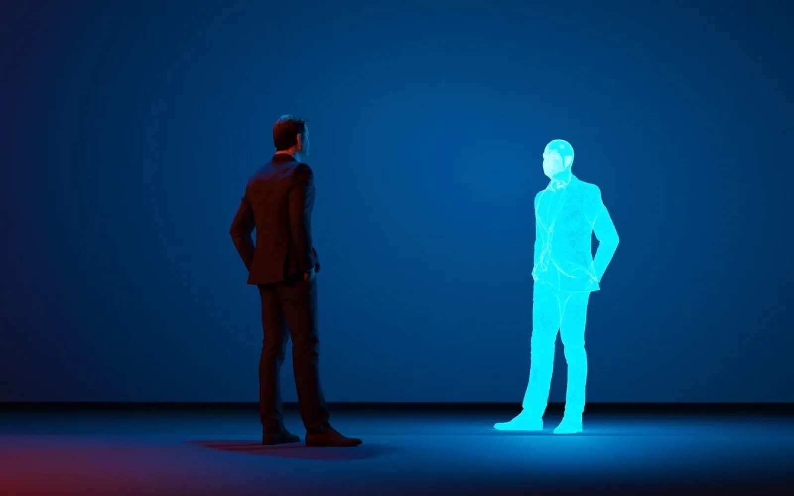 A man in a dark room facing a glowing wireframe copy of himself.